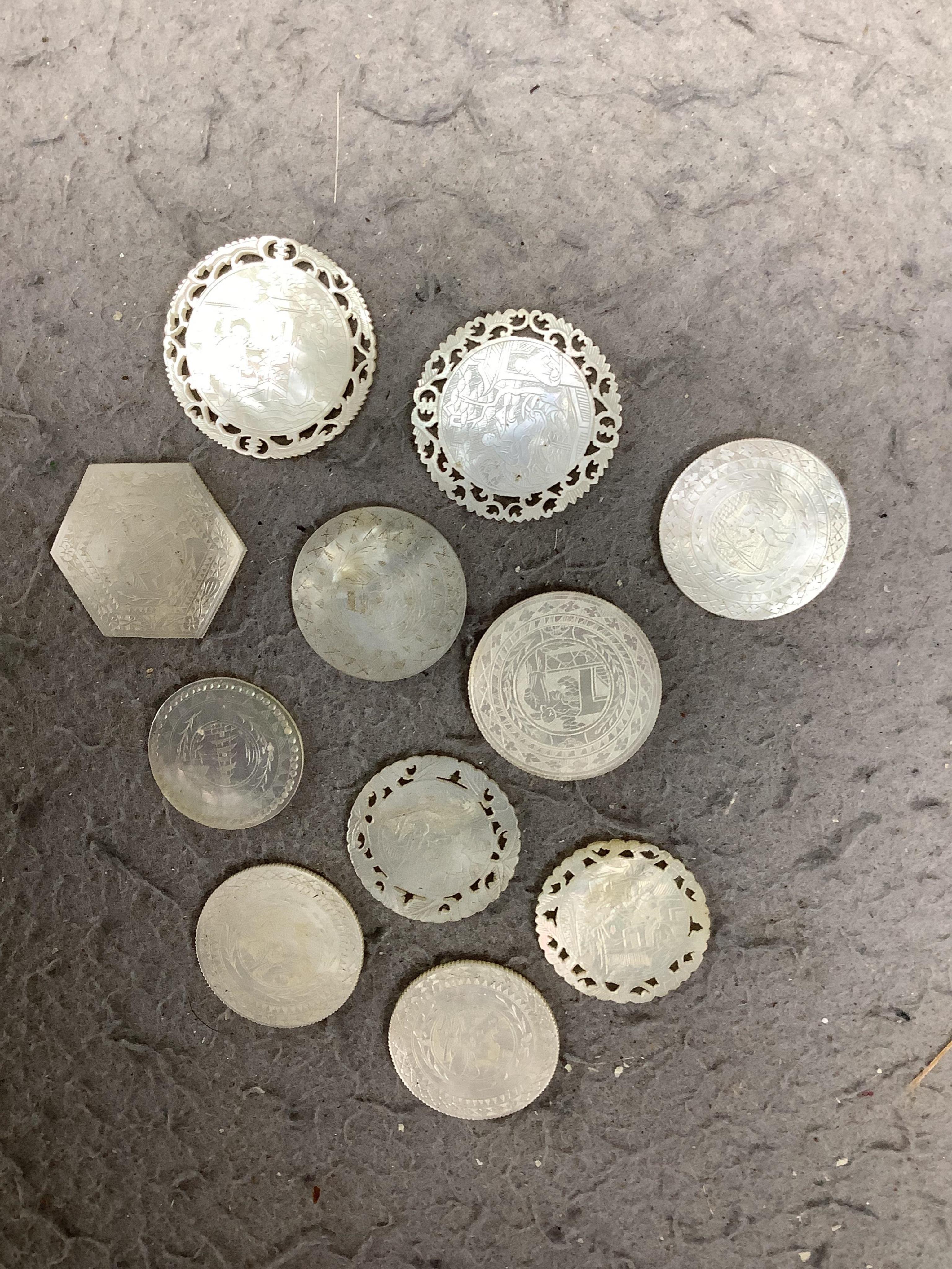 An extensive collection of Chinese mother of pearl gaming counters, in an album. Condition - the majority of the counters in good condition, occasional examples with tiny splinter edge chips